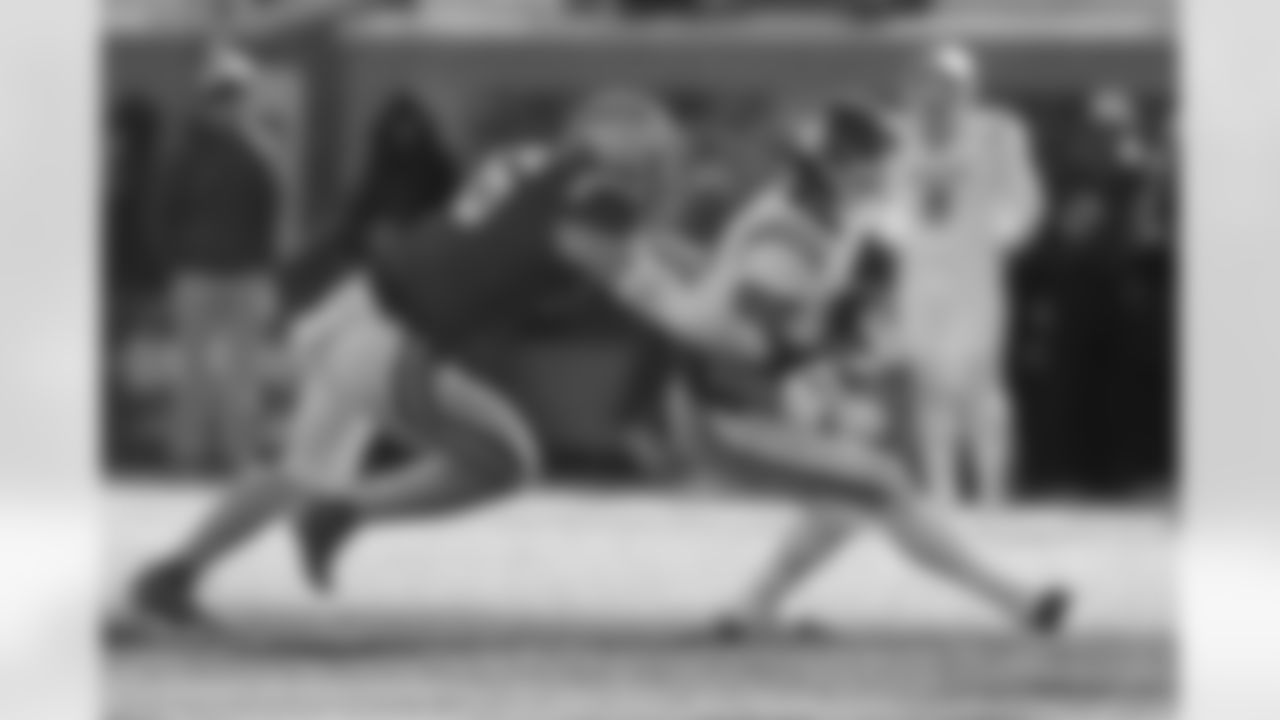 American Team running back Jaydn Ott (8) of Oklahoma, is tackled by National Team linebacker Bryce Boettcher (46), of Oregon, as he carries the ball during the second half of the Senior Bowl NCAA college football game Saturday, Jan. 31, 2026, in Mobile, Ala. (AP Photo/Butch Dill)