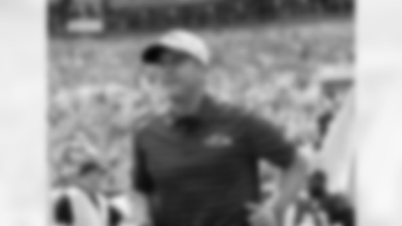 Baltimore Ravens' Head coach John Harbaugh runs onto Lambeau field before a preseason NFL football game against the Green Bay Packers Saturday, Aug. 24, 2024, in Green Bay, Wis. (AP Photo/Jeffrey Phelps