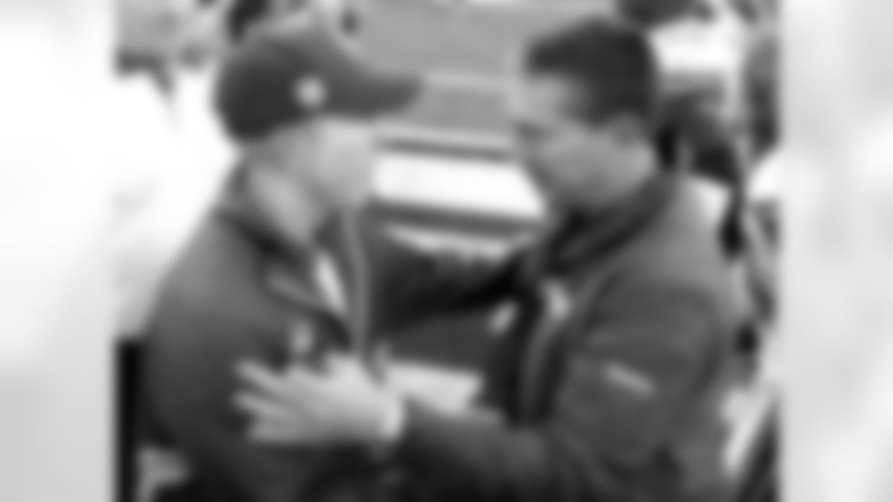 New York Giants head coach Tom Coughlin, left, and Detroit Lions head coach Jim Schwartz, right, greet each other after an NFL football game at New Meadowlands Stadium, Sunday, Oct. 17, 2010, in East Rutherford, N.J. The Giants won the game 28-20. (AP Photo/Tim Larsen)