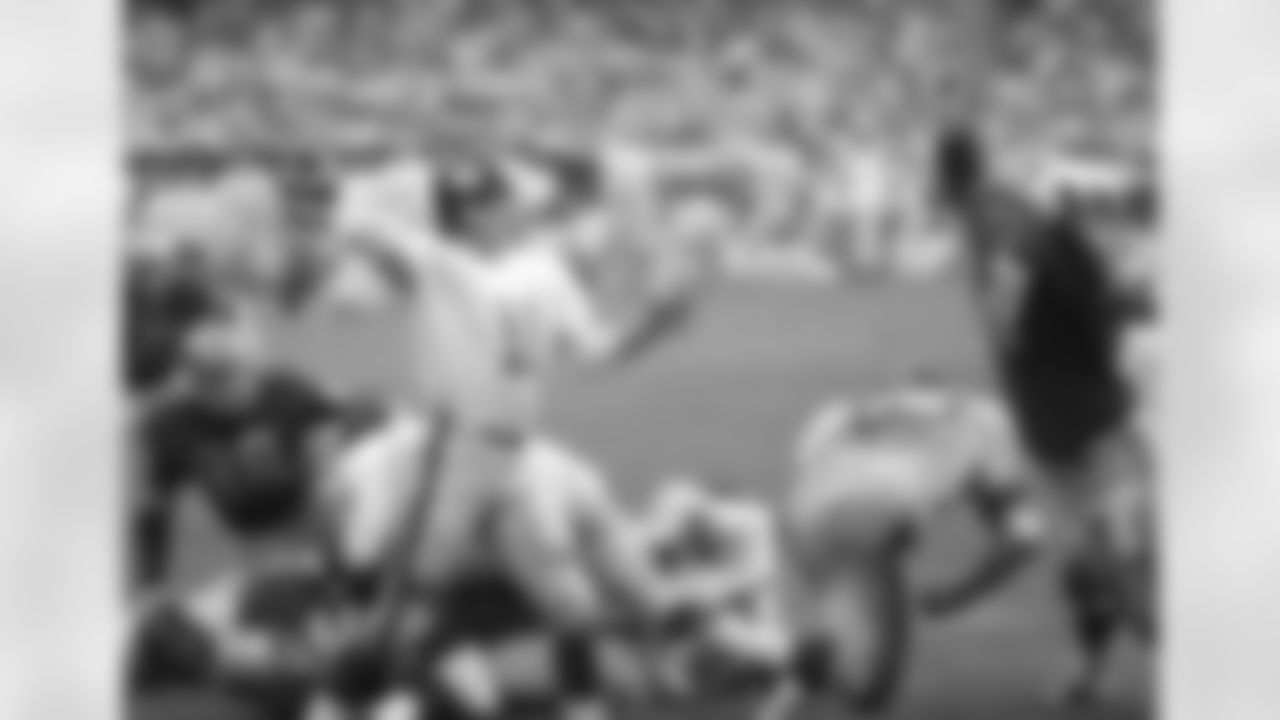 Detroit Lions lions Alex Karras (71) attempts to block a pass by New York Giants quarterback Earl Morrall (11) during an NFL game in this undated photo. (Tony Tomsic via AP)