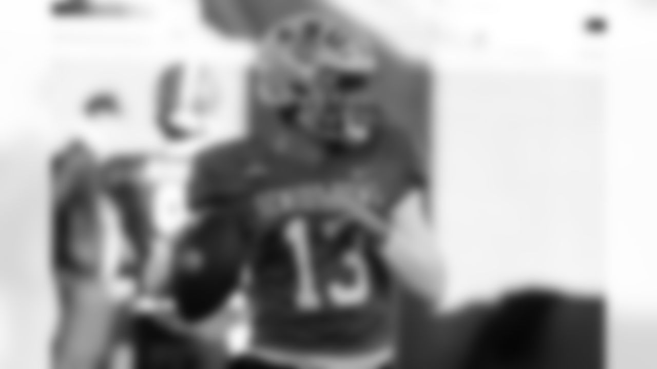 American Team quarterback Garrett Nussmeier (13), of LSU, runs through drills during practice for the Senior Bowl NCAA college football game Tuesday, Jan. 27, 2026, in Mobile, Ala. (AP Photo/Butch Dill)