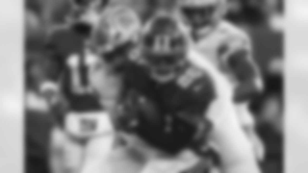 New York Giants running back Saquon Barkley (26) runs the ball against Detroit Lions linebacker Alex Anzalone (34), Sunday, Nov. 20, 2022, in East Rutherford, N.J. (AP Photo/John Munson)