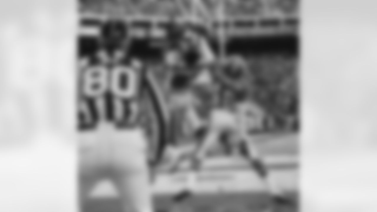 Jacksonville Jaguars' Keenan McCardell catches a 31-yard pass for a touchdown in the third quarter over the top of Denver Broncos' Lionel Washington in their AFC playoff game in Denver on Saturday, Jan. 4, 1997. Jacksonville upset Denver 30-27.(AP Photo/Bryan Kelsen)