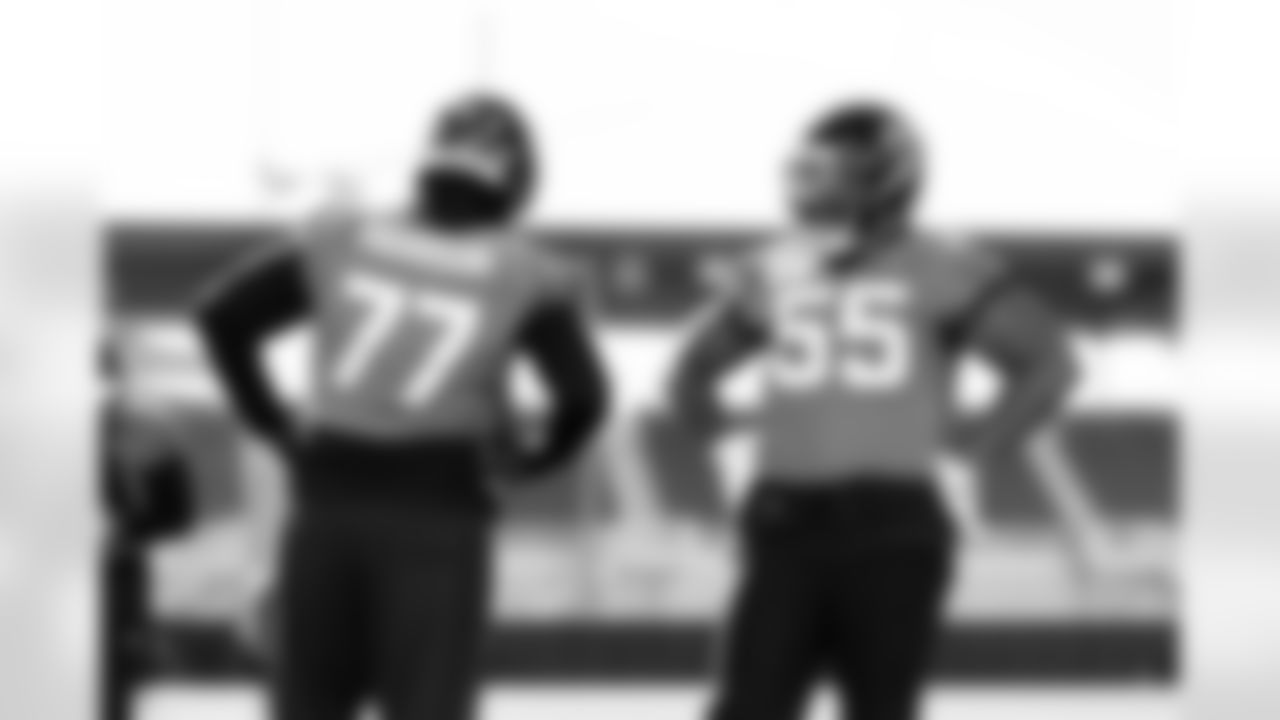 Jacksonville, Fla. — Jaguars offensive lineman Anton Harrison (77) and offensive lineman Chuma Edoga (55) during practice at the Miller Electric Center on December 11, 2025.