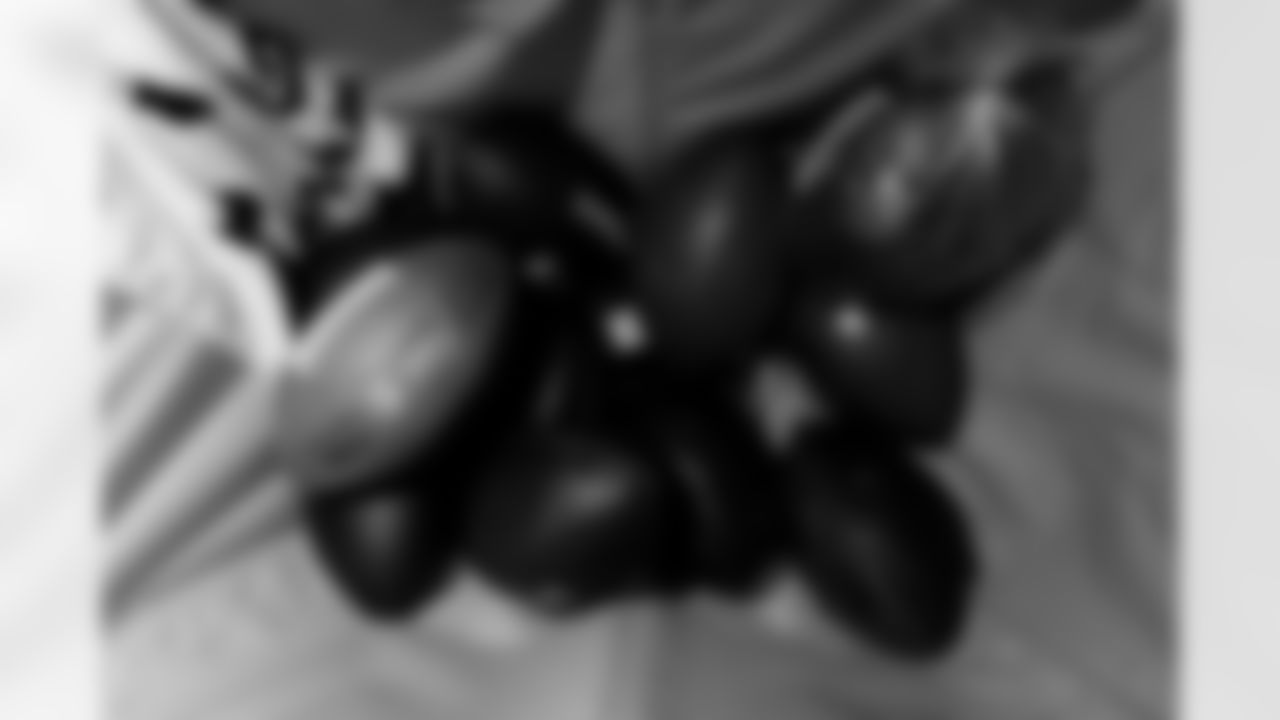 Jacksonville, Fla. — Jaguars football equipment staff prepare America 250 commemorative footballs at the Miller Electric Center on December 29, 2025.