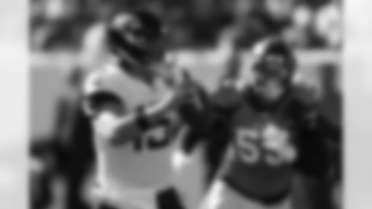 Jacksonville Jaguars quarterback Gardner Minshew, left, scrambles under pressure from Denver Broncos outside linebacker Bradley Chubb, right, during the first half of an NFL football game Sunday, Sept. 29, 2019, in Denver. (AP Photo/David Zalubowski)