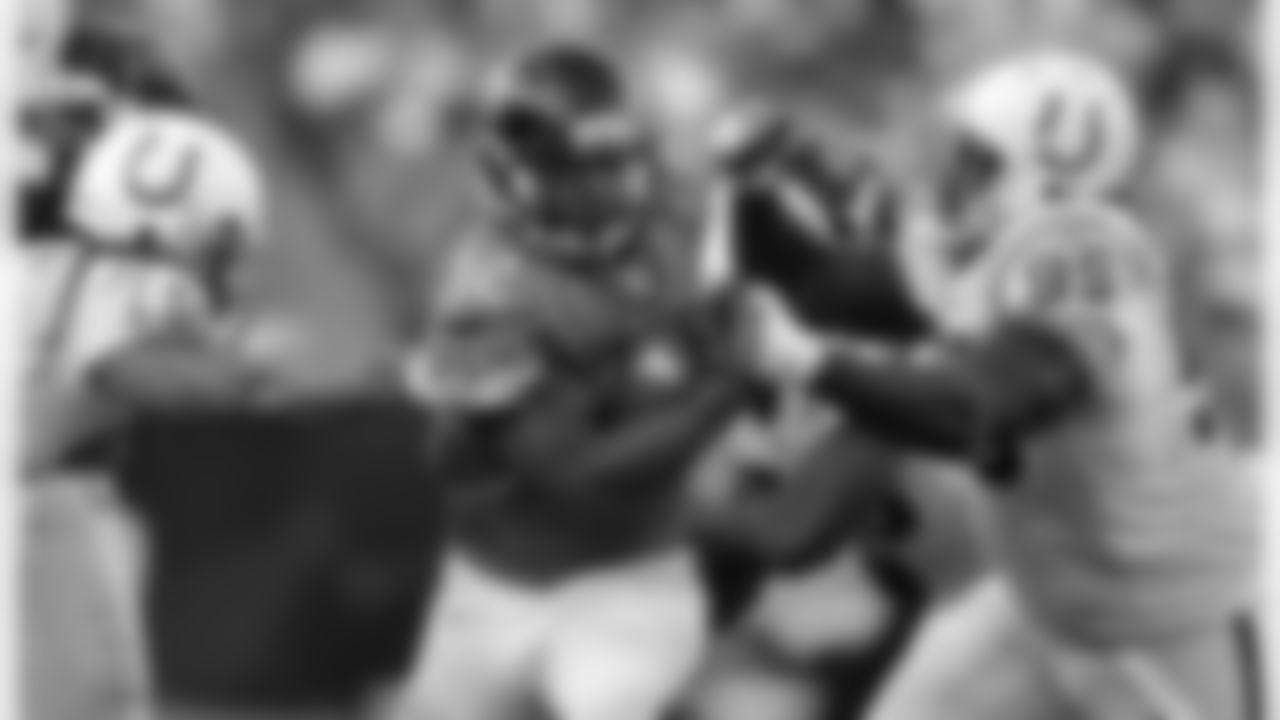 Jacksonville Jaguars running back Maurice Jones-Drew (32) runs for yardage past Indianapolis Colts defensive tackle Antonio Johnson (99) and Indianapolis Colts linebacker Philip Wheeler (50) during an NFL football game Sunday, Oct. 3, 2010 in Jacksonville, Fla. Jacksonville beat Indianapolis 31-28 on a last second field goal. (AP Photo/Stephen Morton)