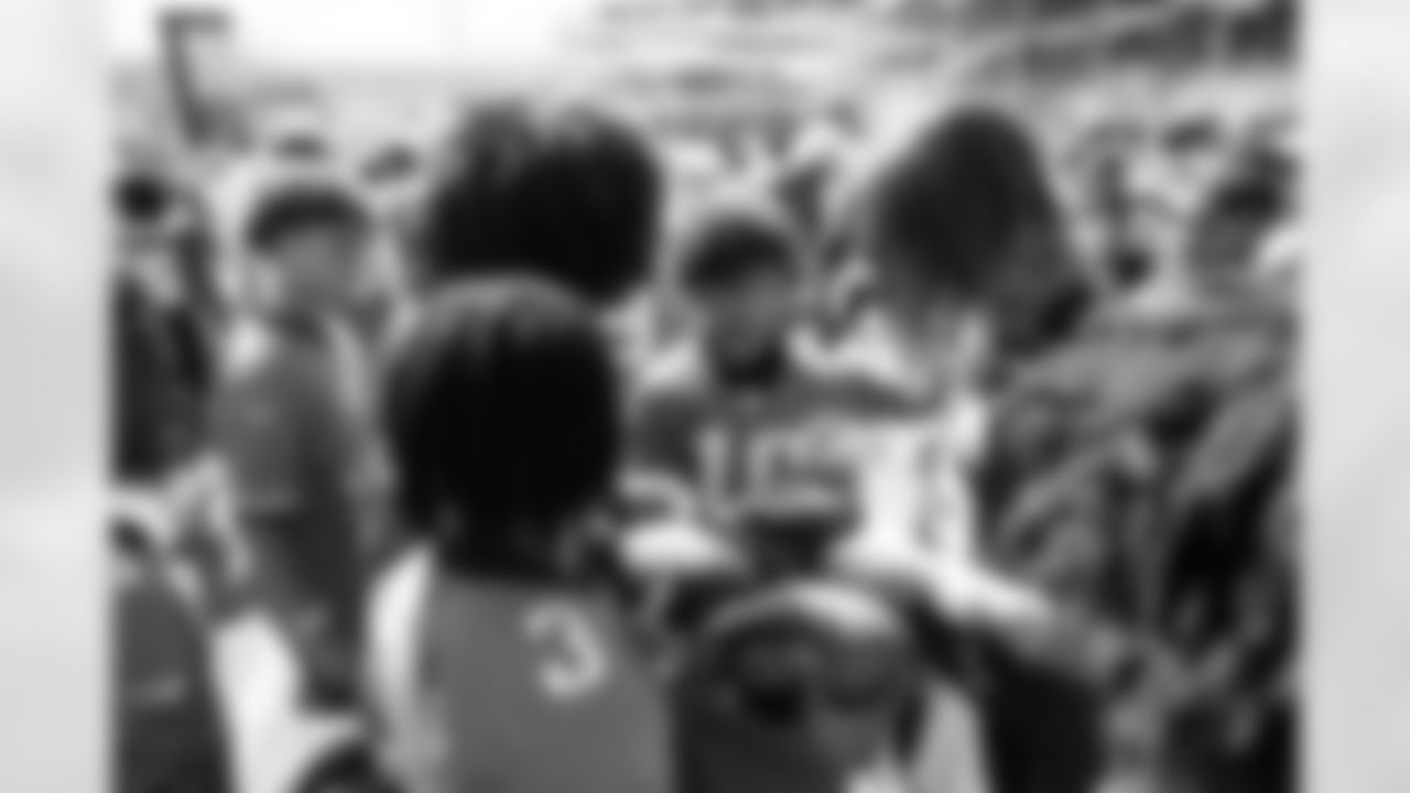 Jacksonville, Fla. — Jaguars quarterback Trevor Lawrence (16) greets the 14U Jaguars Elite Boys NFL Flag champions during training camp at the Miller Electric Center on July 27, 2025.