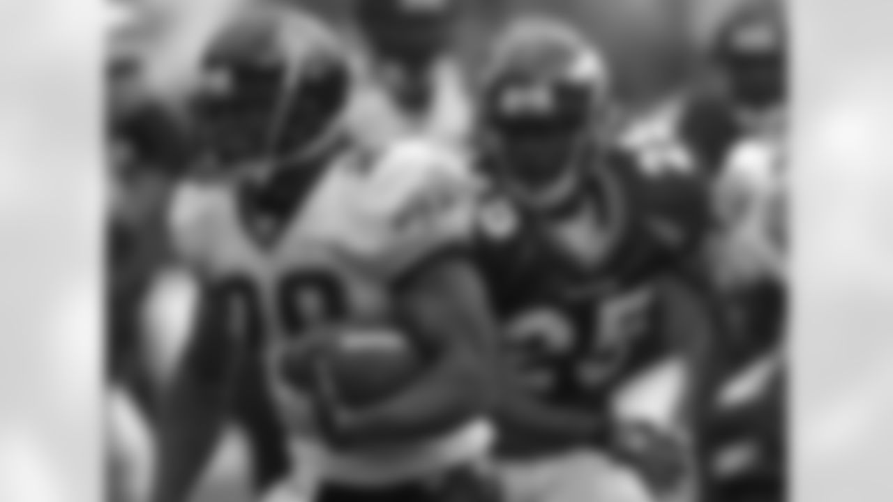 Jacksonville Jaguars' Fred Taylor (28) rushes for extra yardage as Denver Broncos safety Nick Ferguson gives chase during the fourth quarter of an NFL football game in Denver, Sunday, Sept. 23, 2007. (AP Photo/Steve Dykes)