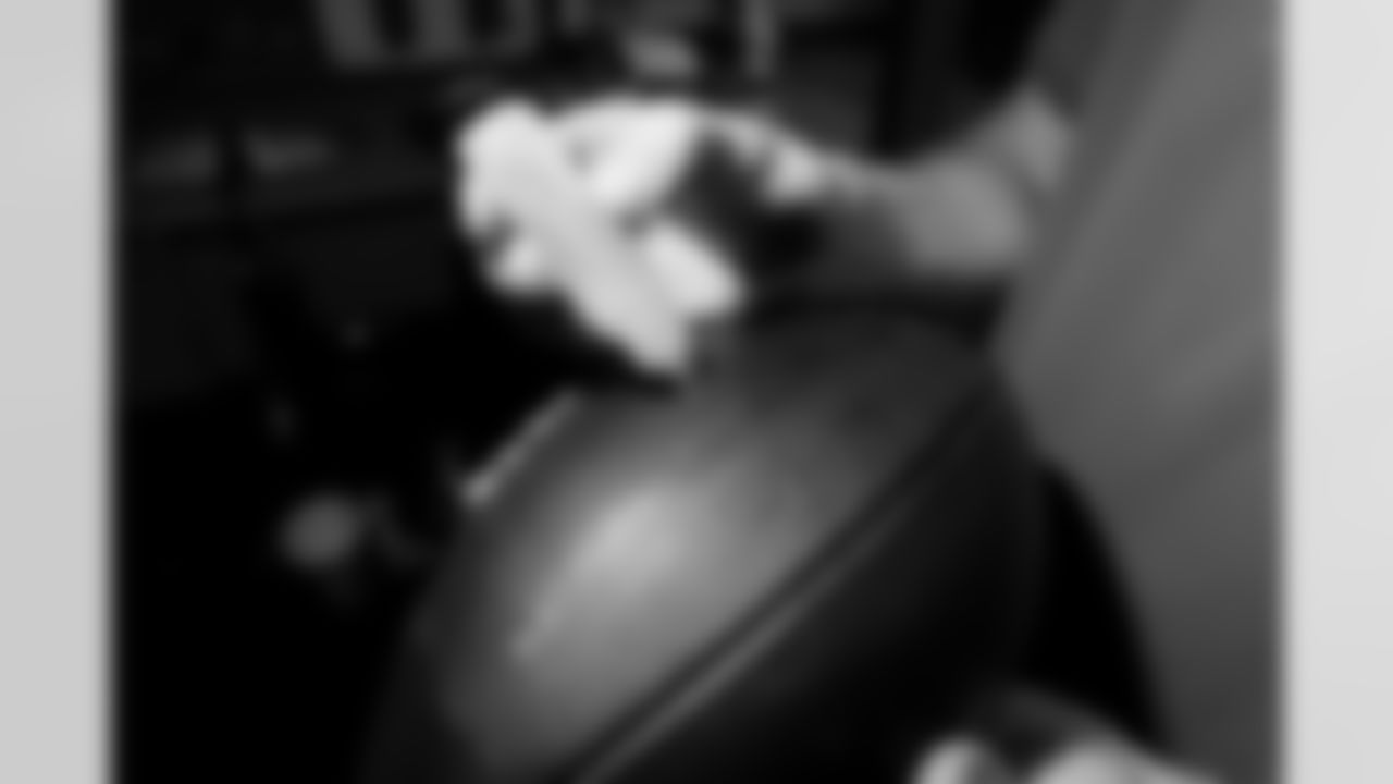 Jacksonville, Fla. — Jaguars football equipment staff prepare America 250 commemorative footballs at the Miller Electric Center on December 29, 2025.