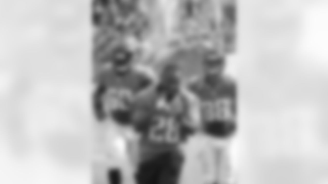 Fomer Jacksonville Jaguars running back Fred Taylor (28) leads the team out on the field before an NFL football game against the Cincinnati Bengals, Sunday, Sept. 30, 2012, in Jacksonville, Fla. (AP Photo/Phelan M. Ebenhack)