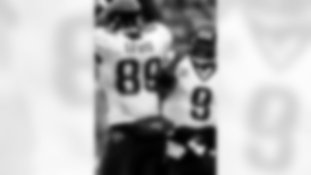 Jacksonville Jaguars tight end Marcedes Lewis, left, celebrates his touchdown catch with quarterback David Garrard against the Denver Broncos in the third quarter of the Jaguars' 24-17 victory in an NFL football game in Denver on Sunday, Oct. 12, 2008. (AP Photo/David Zalubowski)