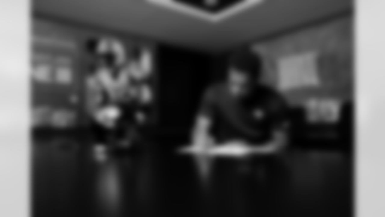Jacksonville, Fla. — Jaguars safety Rayuan Lane III signs his rookie contract at the Miller Electric Center on May 8, 2025.