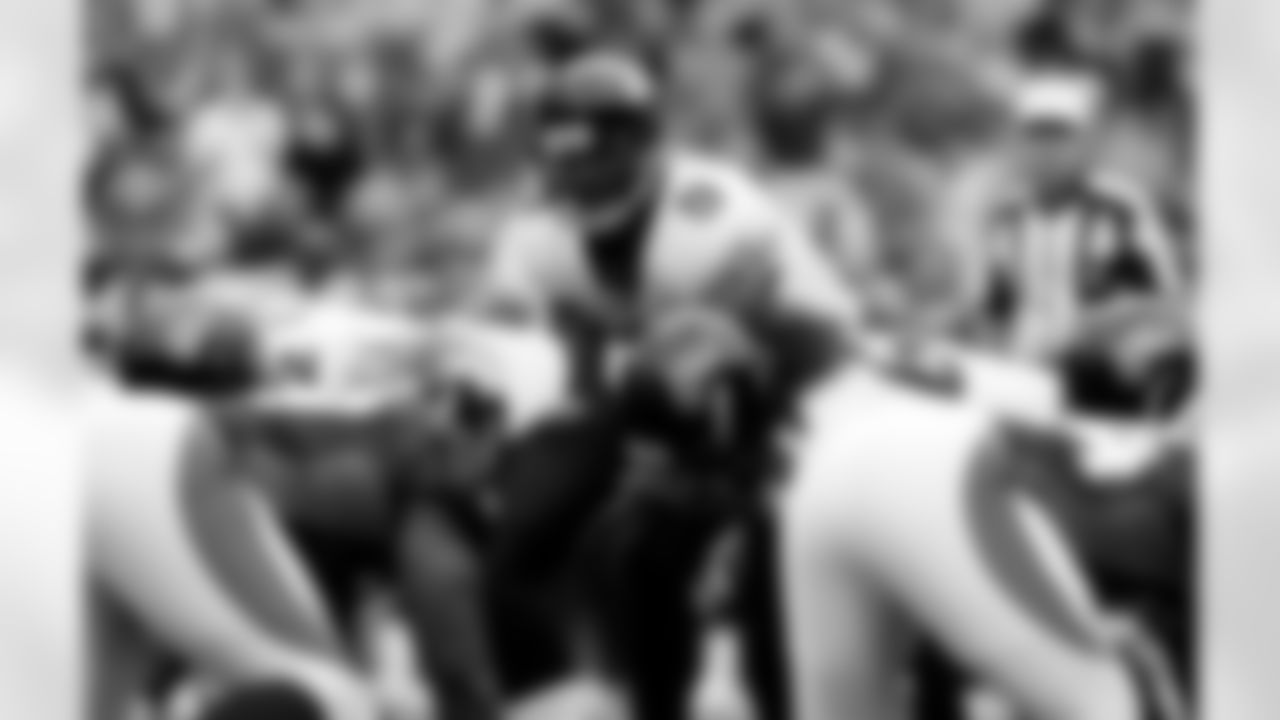 Jacksonville Jaguars quarterback David Garrard (9) waits to take the snap from center against the Denver Broncos in the first quarter of the Jaguars' 24-13 victory in a football game in Denver on Sunday, Sept. 23, 2007. (AP Photo/David Zalubowski)