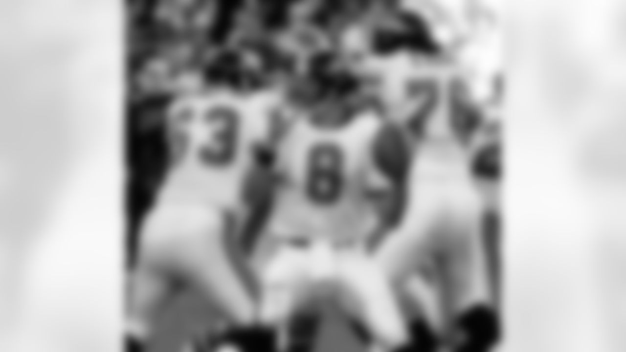 Jacksonville Jaguars quarterback Mark Brunell looks for an open man during the third quarter against the Denver Broncos during an AFC playoff game Saturday, Jan. 4, 1997, in Denver. Blocking for him are Michael Cheever (63) and Rich Tylski (76). Ever wonder how Mark Brunell went from battling Ty Detmer for a backup role in Green Bay to one of the hottest young quarterbacks in the NFL? You're not alone. (AP Photo/Michael S. Green)