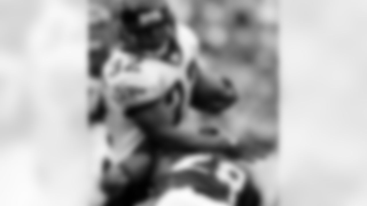 Jacksonville Jaguars running back Maurice Jones-Drew (32) is tackled by Denver Broncos corner back Jeff Shoate in the first quarter of the Jaguars' 24-13 victory in a football game in Denver on Sunday, Sept. 23, 2007. (AP Photo/David Zalubowski)