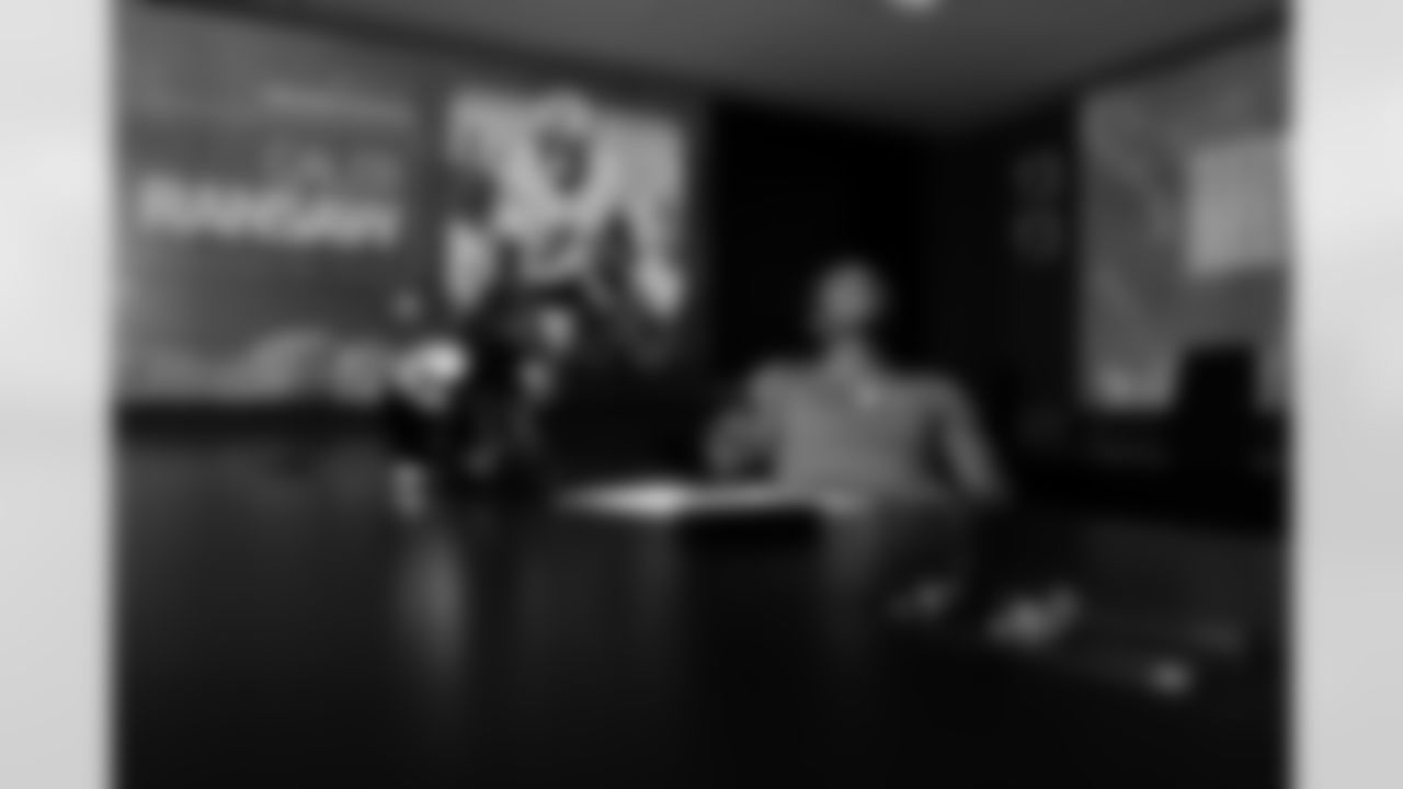 Jacksonville, Fla. — Jaguars defensive back Caleb Ransaw signs his rookie contract at the Miller Electric Center on May 8, 2025.