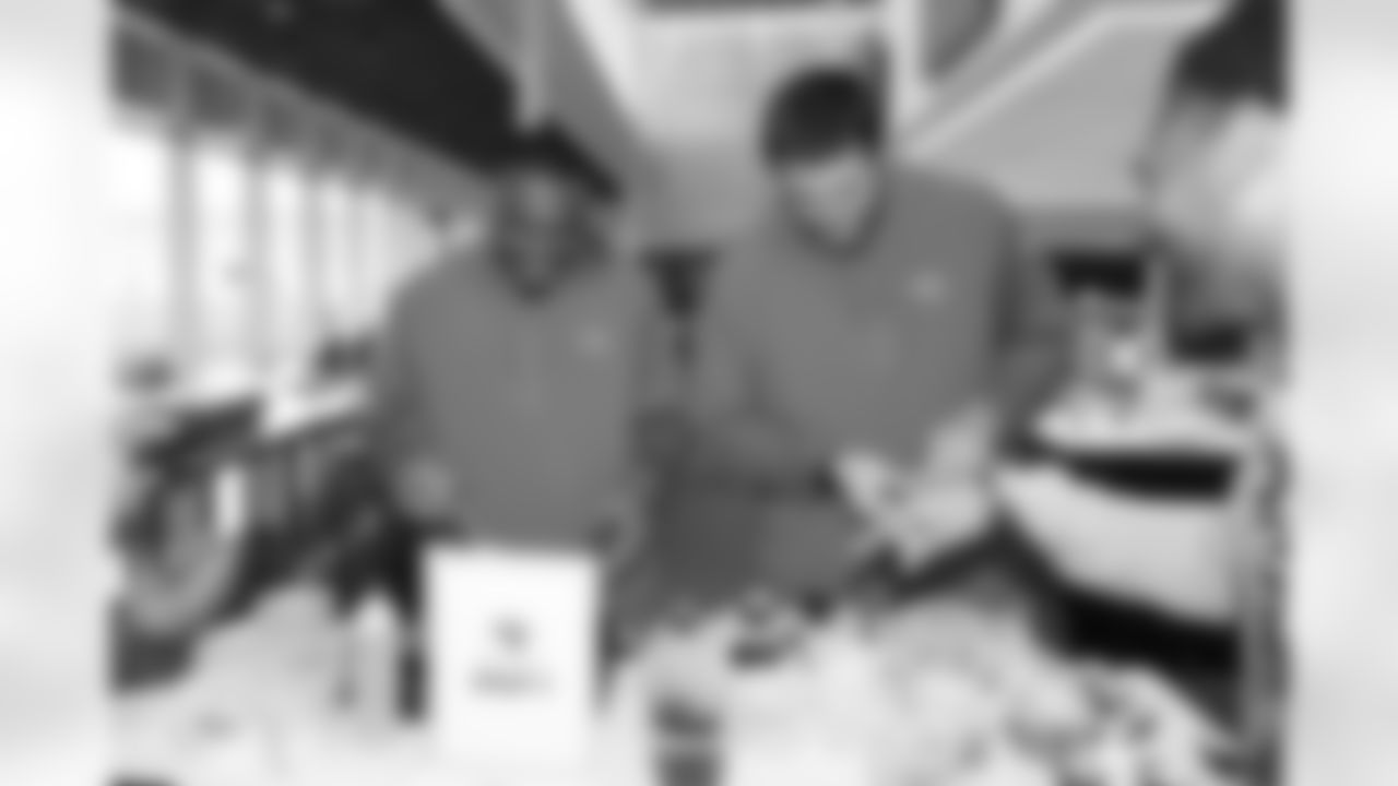 Jacksonville, Fla. — Jaguars defensive lineman B.J. Green II (left) and offensive lineman Wyatt Milum (right) during the rookie cooking competition at the Miller Electric Center on June 3, 2025.