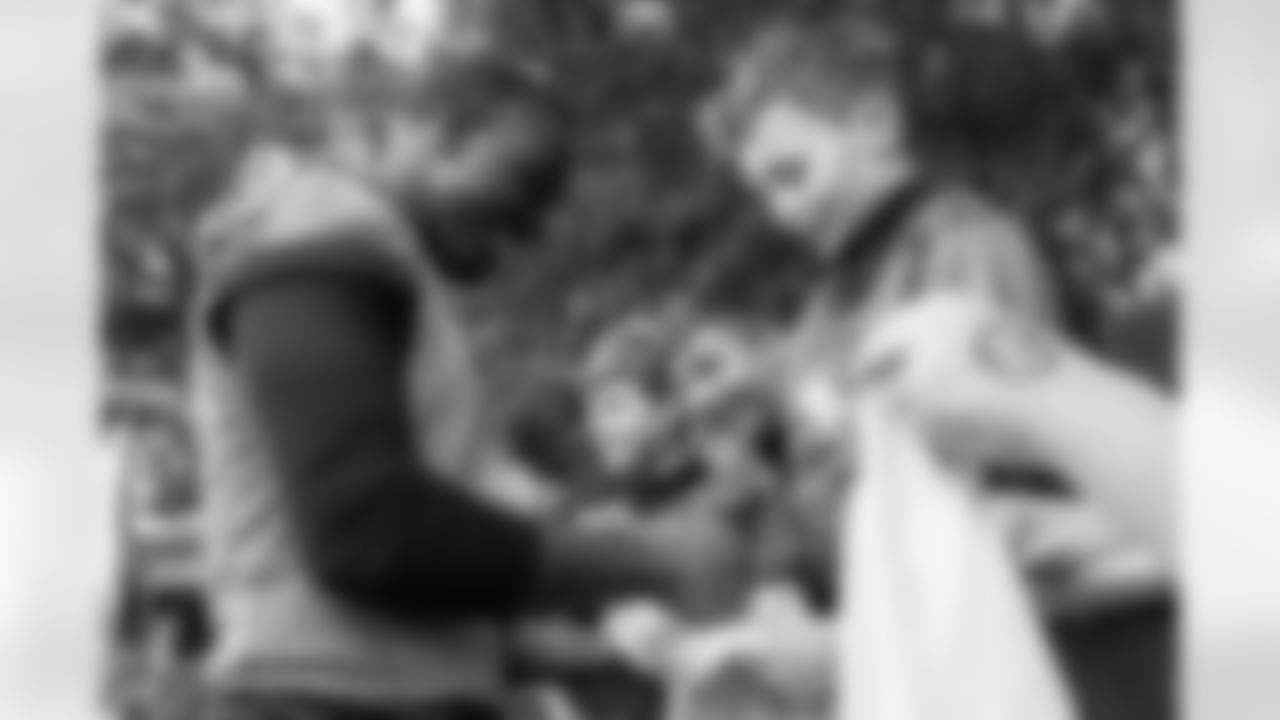 Watford, U.K. — Jaguars running back Travis Etienne Jr. (1) greets JagTag athletes after practice at The Grove on October 17, 2025.