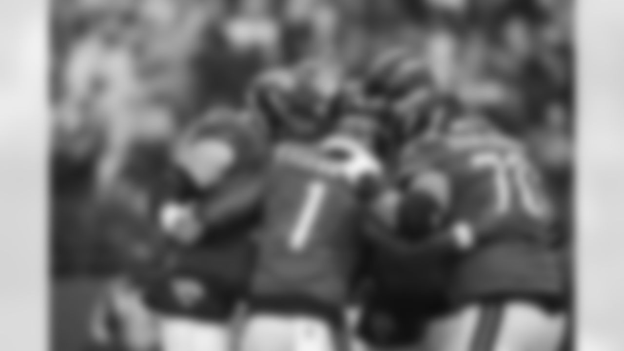 Jacksonville Jaguars vs Indianapolis Colts

OL Robert Hainsey (73), RB Travis Etienne Jr. (1) and OL Cole Van Lanen (70)