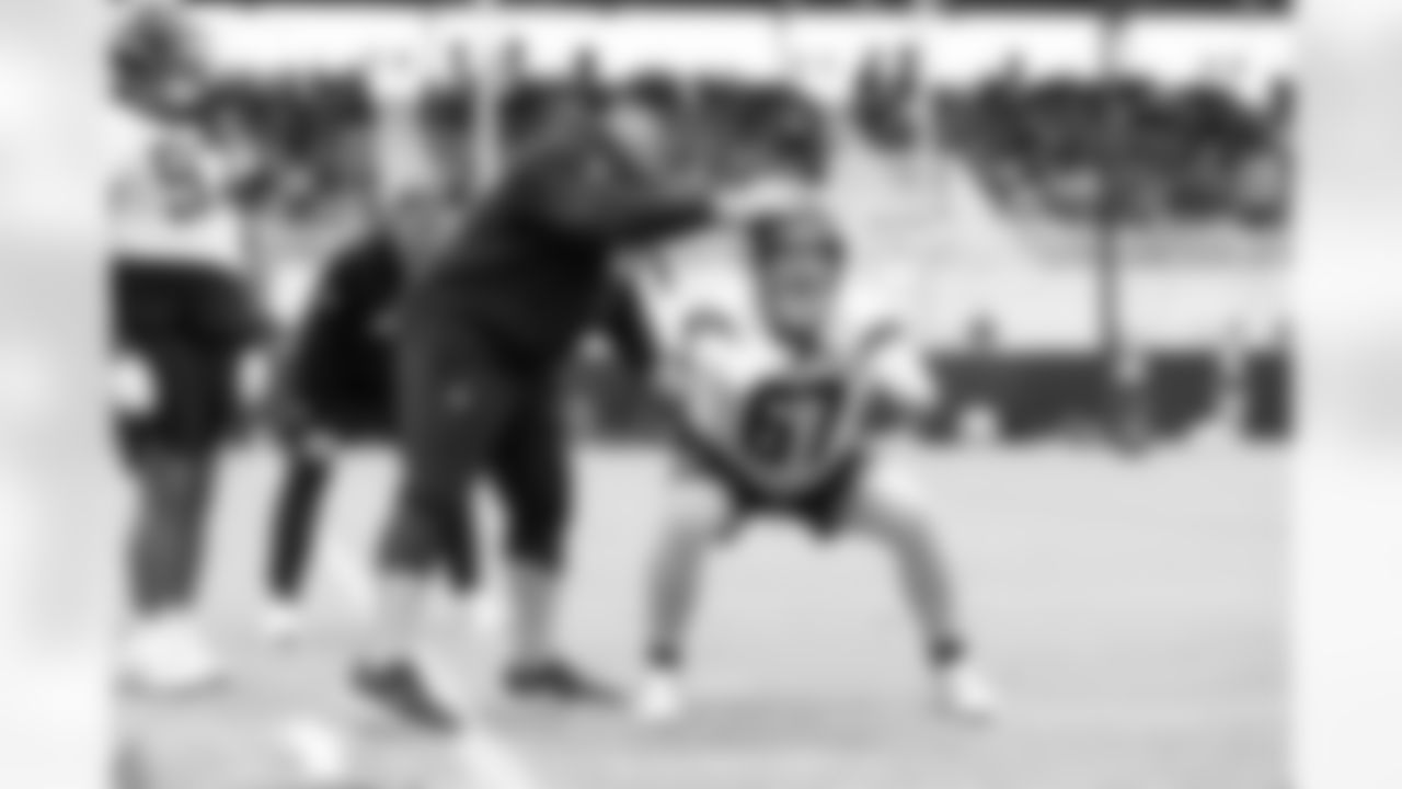 Jacksonville, Fla. — Jaguars defensive line coach Matt Edwards and defensive lineman Eli Mostaert (67) during rookie minicamp at the Miller Electric Center on May 10, 2025.