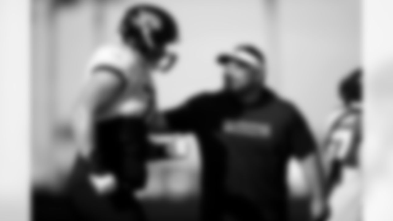 Jacksonville, Fla. — Jaguars offensive lineman Ezra Cleveland (76) and assistant offensive line/run game specialist Keli'i Kekuewa during training camp at the Miller Electric Center on August 12, 2025.