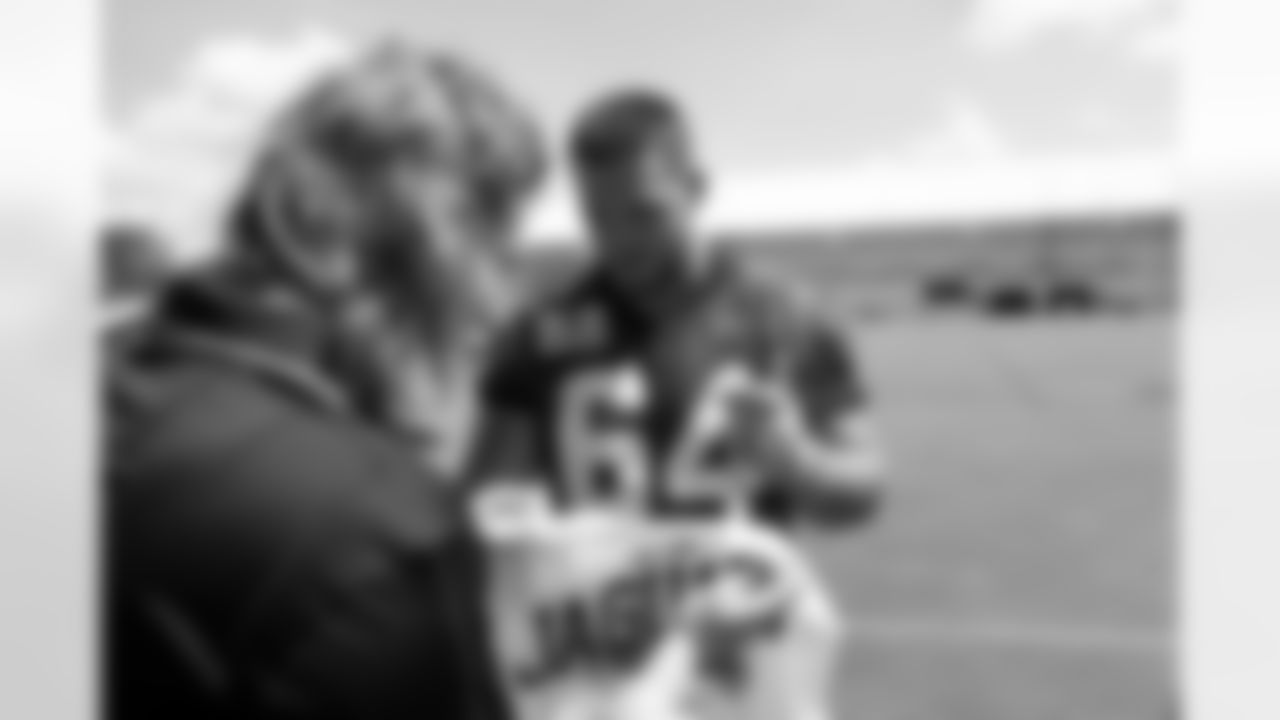 Jacksonville, Fla. — Jaguars offensive lineman Wyatt Milum (64) signs autographs for fans during mandatory minicamp at the Miller Electric Center on June 11, 2025.