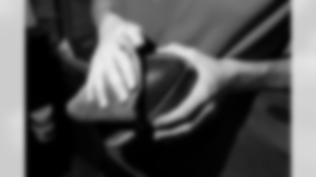 Jacksonville, Fla. — Jaguars football equipment staff prepare America 250 commemorative footballs at the Miller Electric Center on December 29, 2025.