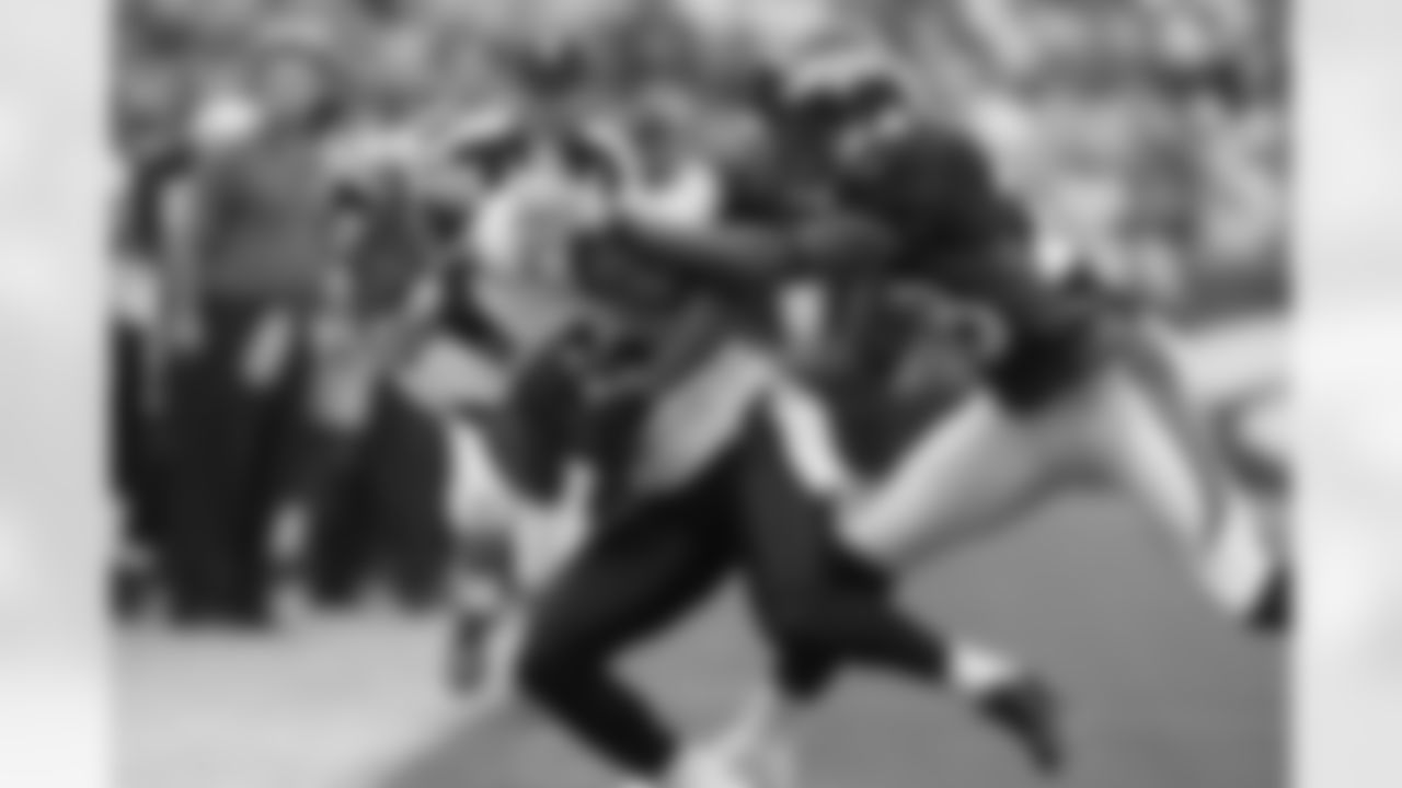 Jacksonville Jaguars' Dennis Northcutt, left, is pushed out of bounds by Denver Broncos' Jeff Shoate, after a pass reception in the second quarter of an NFL football game in Denver, Sunday, Sept. 23, 2007. (AP Photo/David Zalubowski)