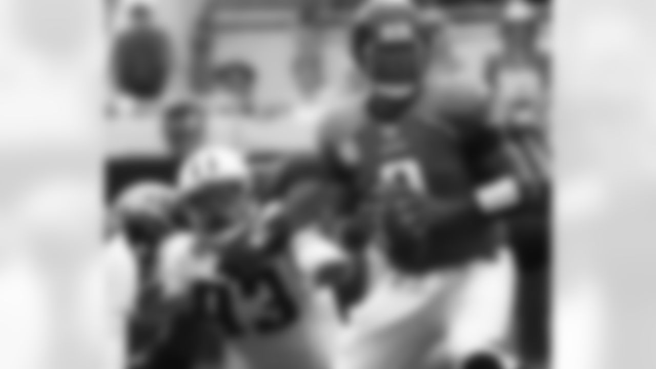 Jacksonville Jaguars quarterback David Garrard looks to throw as Tennessee Titans defensive end Larry Birdine, left, reaches out in an attempt to make the tackle during the second quarter of an NFL football game, Sunday, Oct. 4, 2009, in Jacksonville, Fla. (AP Photo/Phil Coale)