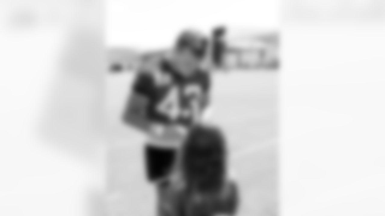 Jacksonville, Fla. — Jaguars tight end John Copenhaver (43) signs autographs for fans during mandatory minicamp at the Miller Electric Center on June 11, 2025.