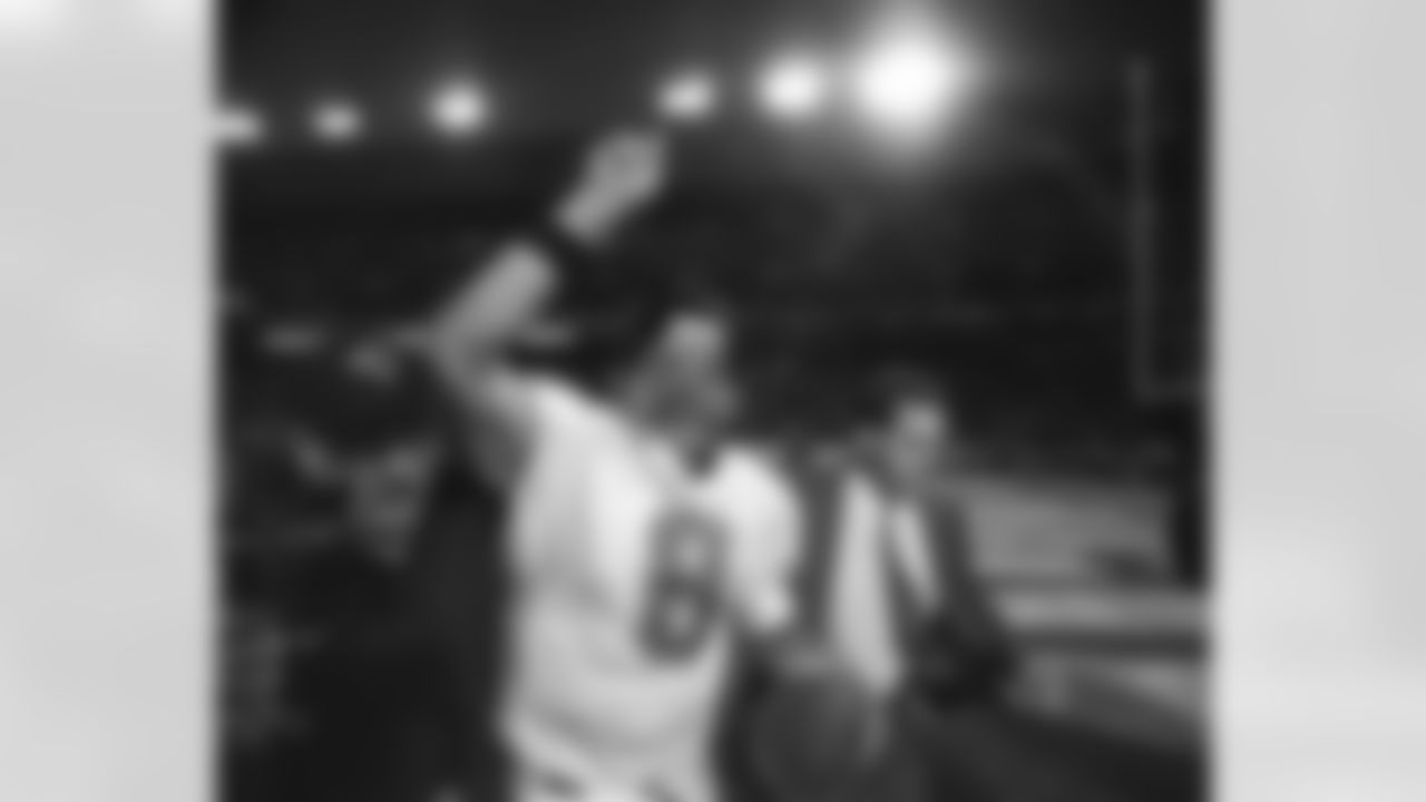 Jacksonville Jaguars quarterback Mark Brunell celebrates after leading his team to a 30-27 upset win over the Broncos in Denver on Saturday, Jan. 4, 1997. (AP Photo/Michael S. Green)