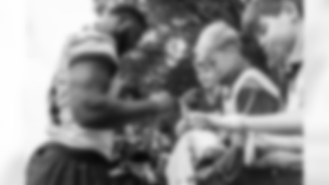 Watford, U.K. — Jaguars defensive end Josh Hines-Allen (41) greets JagTag athletes after practice at The Grove on October 17, 2025.