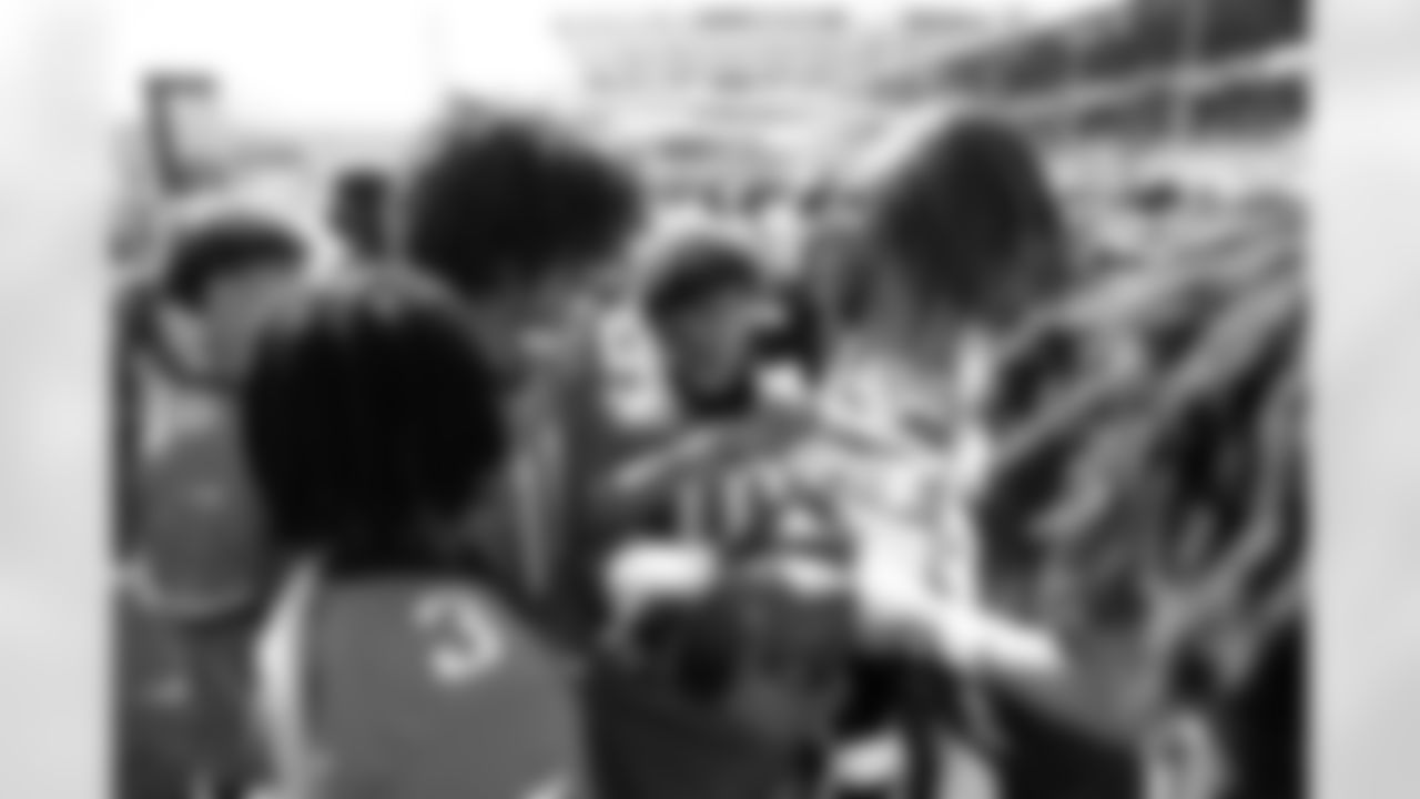 Jacksonville, Fla. — Jaguars quarterback Trevor Lawrence (16) greets the 14U Jaguars Elite Boys NFL Flag champions during training camp at the Miller Electric Center on July 27, 2025.