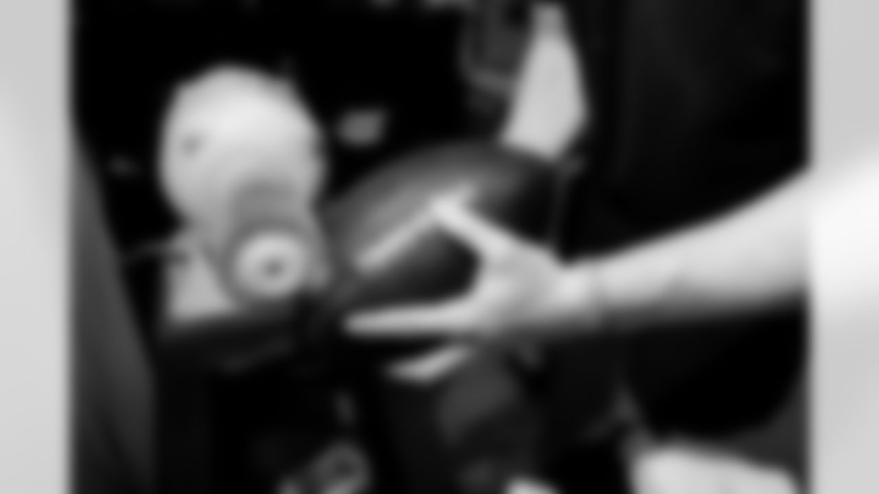 Jacksonville, Fla. — Jaguars football equipment staff prepare America 250 commemorative footballs at the Miller Electric Center on December 29, 2025.