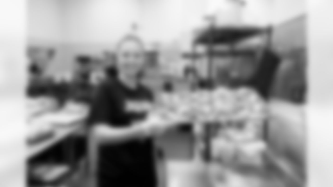 Jacksonville, Fla. — Jaguars staff members volunteer prepping food at the Sulzbacher on April 7, 2025.