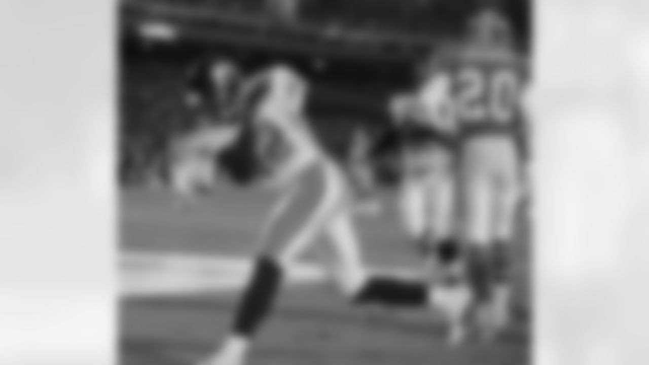 Jacksonville Jaguars Jimmy Smith spikes the ball after catching a 16-yard touchdown pass in the closing minutes of Jacksonville's 30-27 upset victory over the Denver Broncos at Mile High Stadium in Denver on Saturday, Jan. 4, 1997. Denver cornerback Tory James (20) walks away at right. (AP Photo/David Zalubowski)