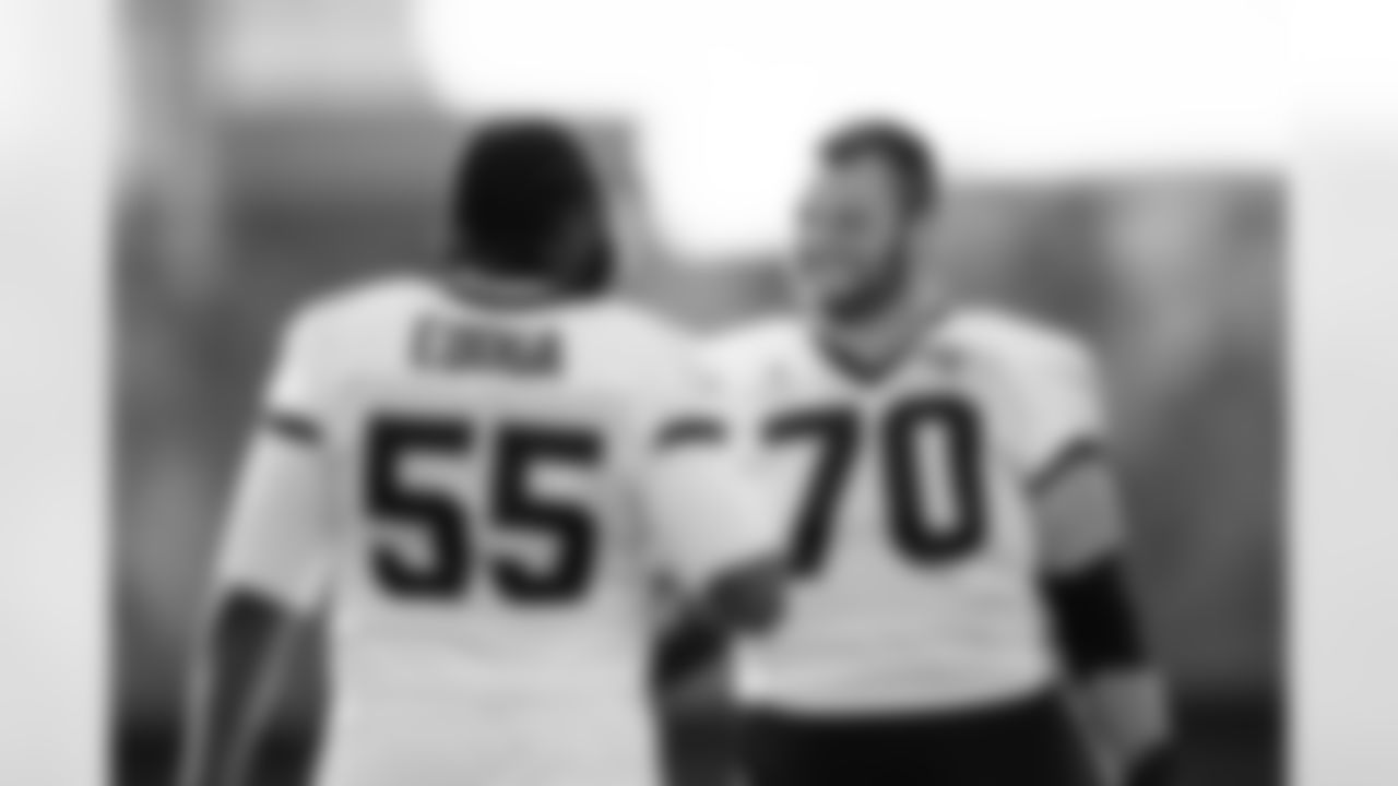 Jacksonville, Fla. — Jaguars offensive lineman Chuma Edoga (55) and offensive lineman Cole Van Lanen (70) during practice at the Miller Electric Center on December 25, 2025.
