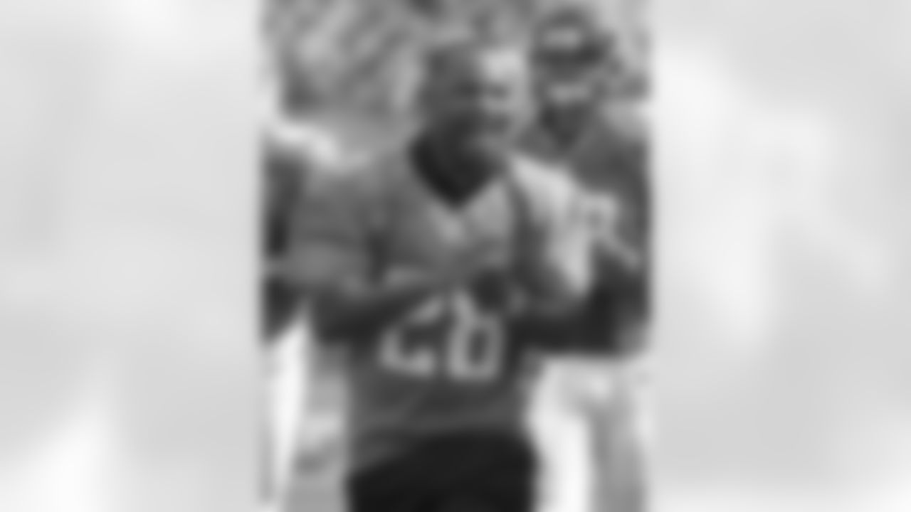 Fomer Jacksonville Jaguars running back Fred Taylor (28) leads the team out on the field before an NFL football game against the Cincinnati Bengals, Sunday, Sept. 30, 2012, in Jacksonville, Fla. (AP Photo/Phelan M. Ebenhack)