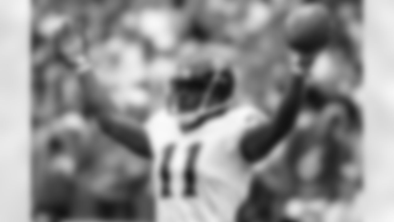 Jacksonville Jaguars' Reggie Williams (11) celebrates his second-quarter touchdown catch against the Denver Broncos in the second quarter of an NFL football game in Denver, Sunday, Sept. 23, 2007. (AP Photo/David Zalubowski)