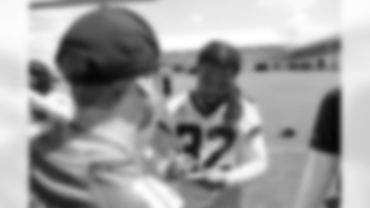 Jacksonville, Fla. — Jaguars safety Cam'Ron Silmon-Craig (32) signs autographs for fans during mandatory minicamp at the Miller Electric Center on June 11, 2025.