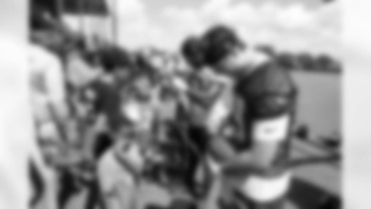 Jacksonville, Fla. — Jaguars quarterback Seth Henigan (19) signs autographs for fans during mandatory minicamp at the Miller Electric Center on June 11, 2025.