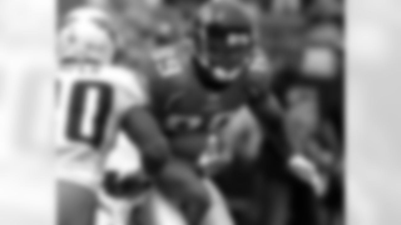 Jacksonville Jaguars tightend Marcedes Lewis looks for running room after making a catch against the Tennessee Titans during an NFL football game, Sunday, Oct. 4, 2009 in Jacksonville, Fla. (AP Photo/Stephen Morton)