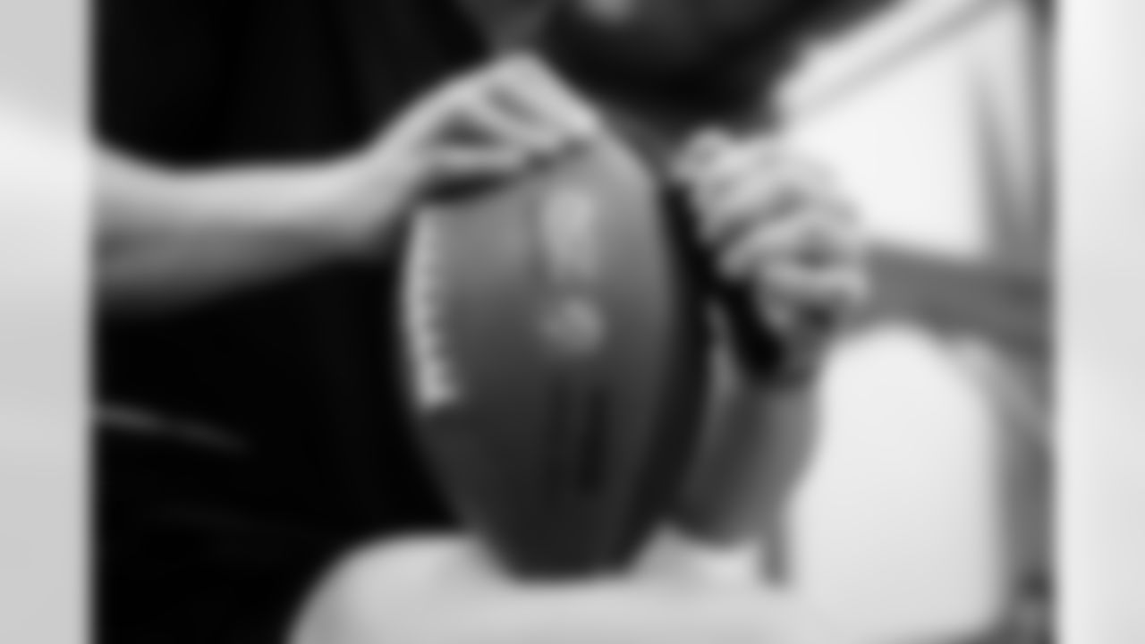 Jacksonville, Fla. — Jaguars football equipment staff prepare America 250 commemorative footballs at the Miller Electric Center on December 29, 2025.