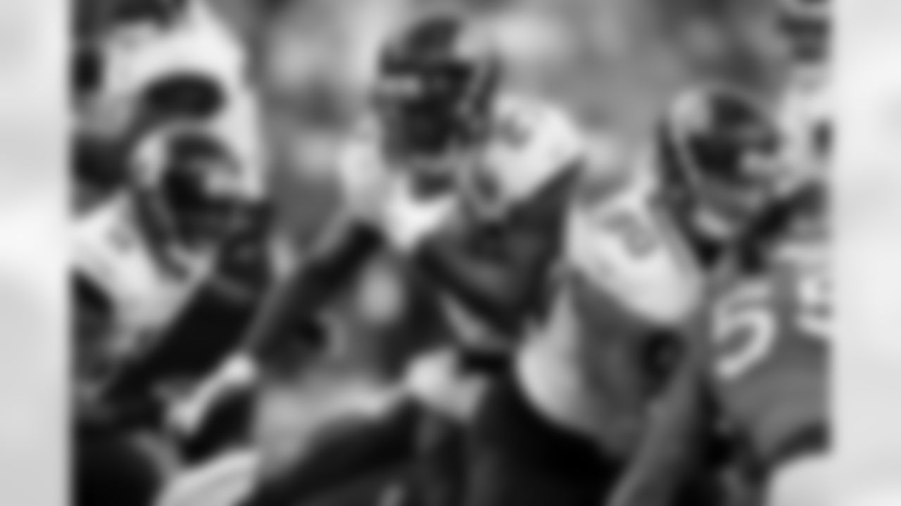 Jacksonville Jaguars running back Leonard Fournette, center, runs with the ball during the second half of an NFL football game against the Denver Broncos, Sunday, Sept. 29, 2019, in Denver. (AP Photo/David Zalubowski)