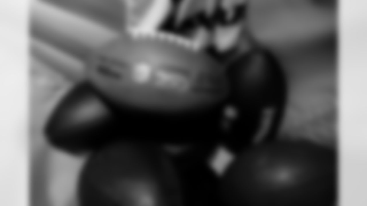 Jacksonville, Fla. — Jaguars football equipment staff prepare America 250 commemorative footballs at the Miller Electric Center on December 29, 2025.