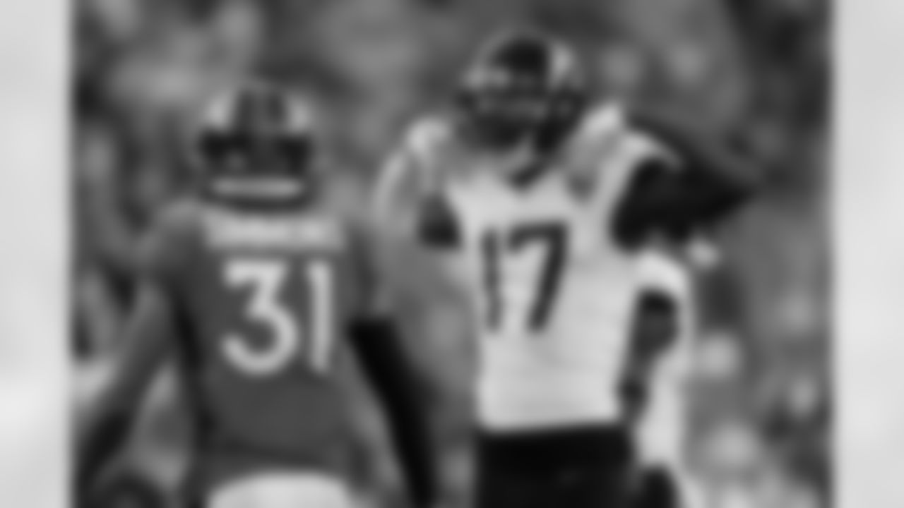 Jacksonville Jaguars wide receiver D.J. Chark reacts after a reception as Denver Broncos free safety Justin Simmons (31) looks on during the second half of an NFL football game Sunday, Sept. 29, 2019, in Denver. (AP Photo/David Zalubowski)