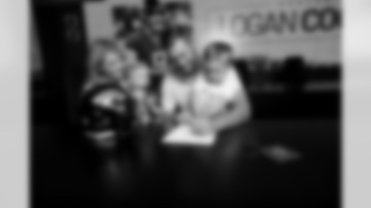 Jacksonville, Fla. — Jaguars punter Logan Cooke poses with his family after signing a contract extension at the Miller Electric Center on June 10, 2025.