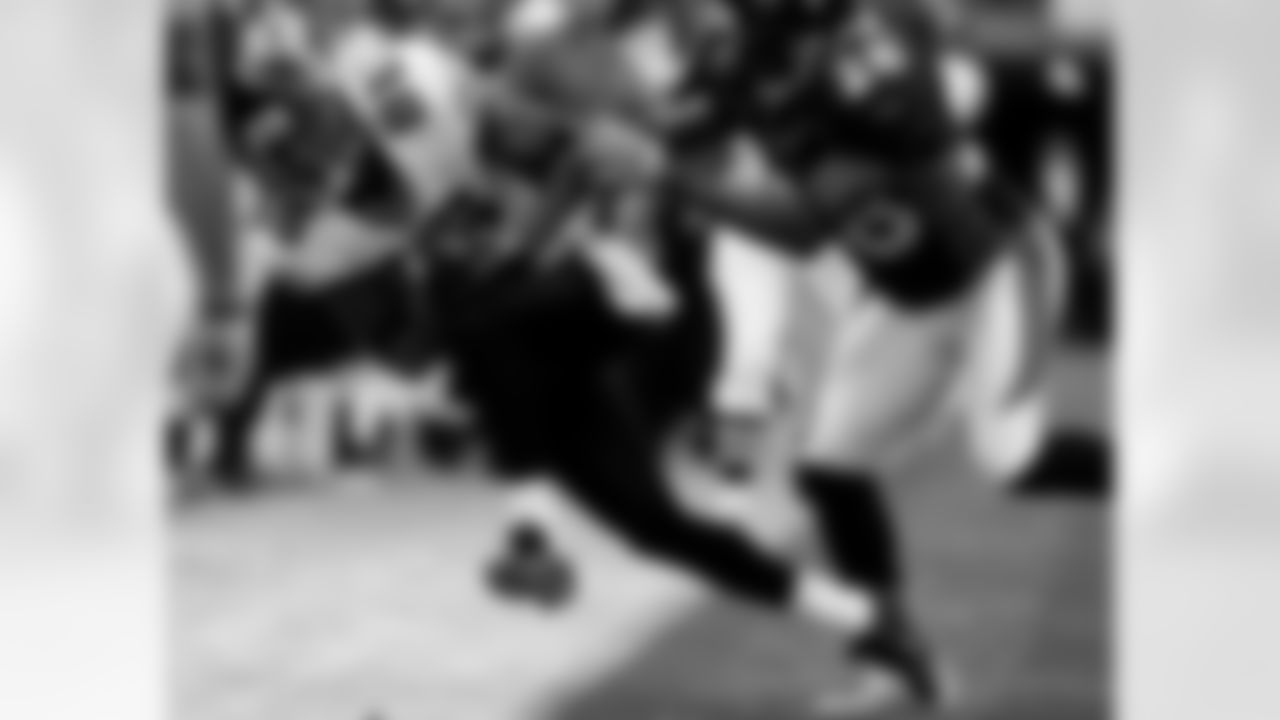 Jacksonville Jaguars wide receiver Dennis Northcutt, left, is pushed out of bounds by Denver Broncos corner back Jeff Shoate after pulling in a pass in the second quarter of the Jaguars' 24-13 victory in a football game in Denver on Sunday, Sept. 23, 2007. (AP Photo/David Zalubowski)