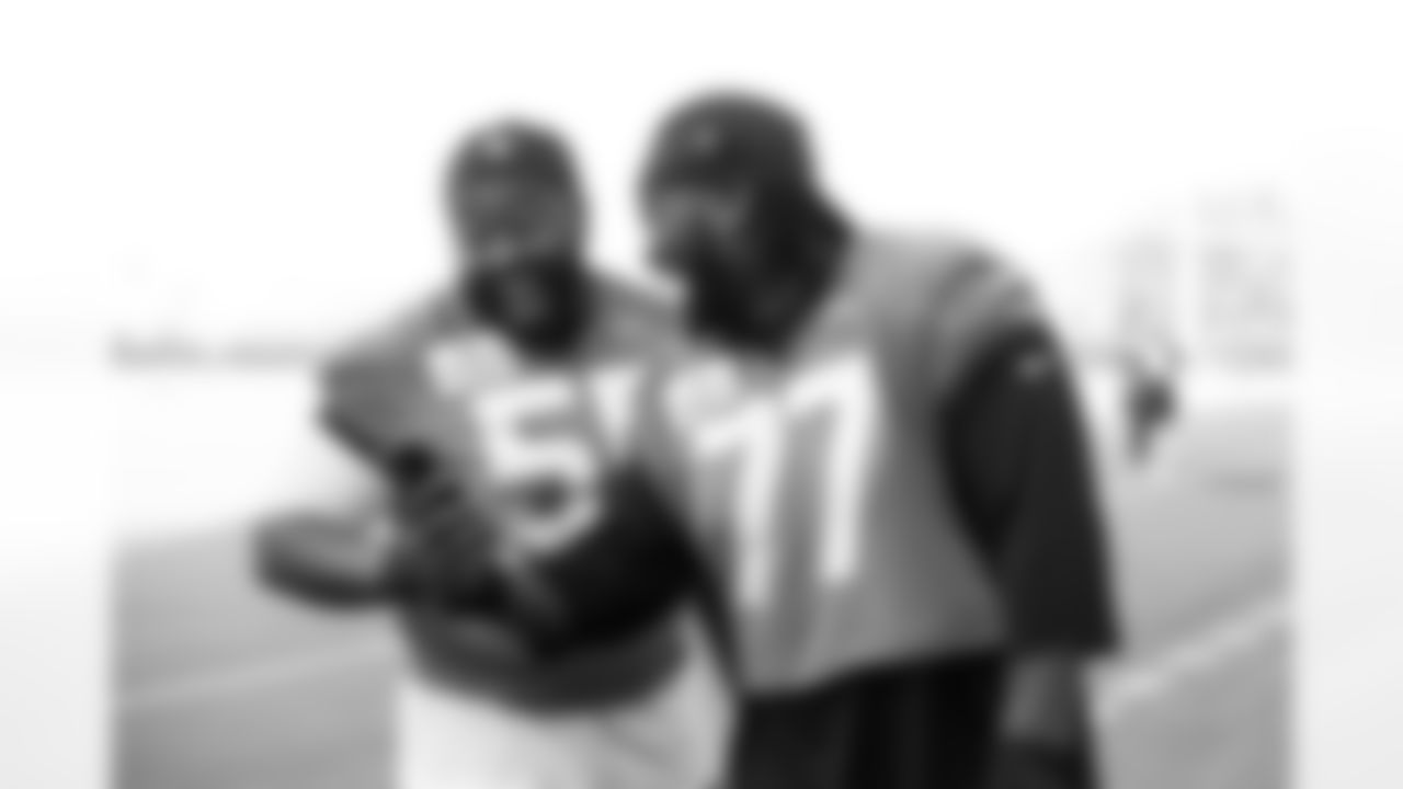Jacksonville, Fla. — Jaguars offensive lineman Chuma Edoga (55) and offensive lineman Anton Harrison (77) before training camp at the Miller Electric Center on July 23, 2025.